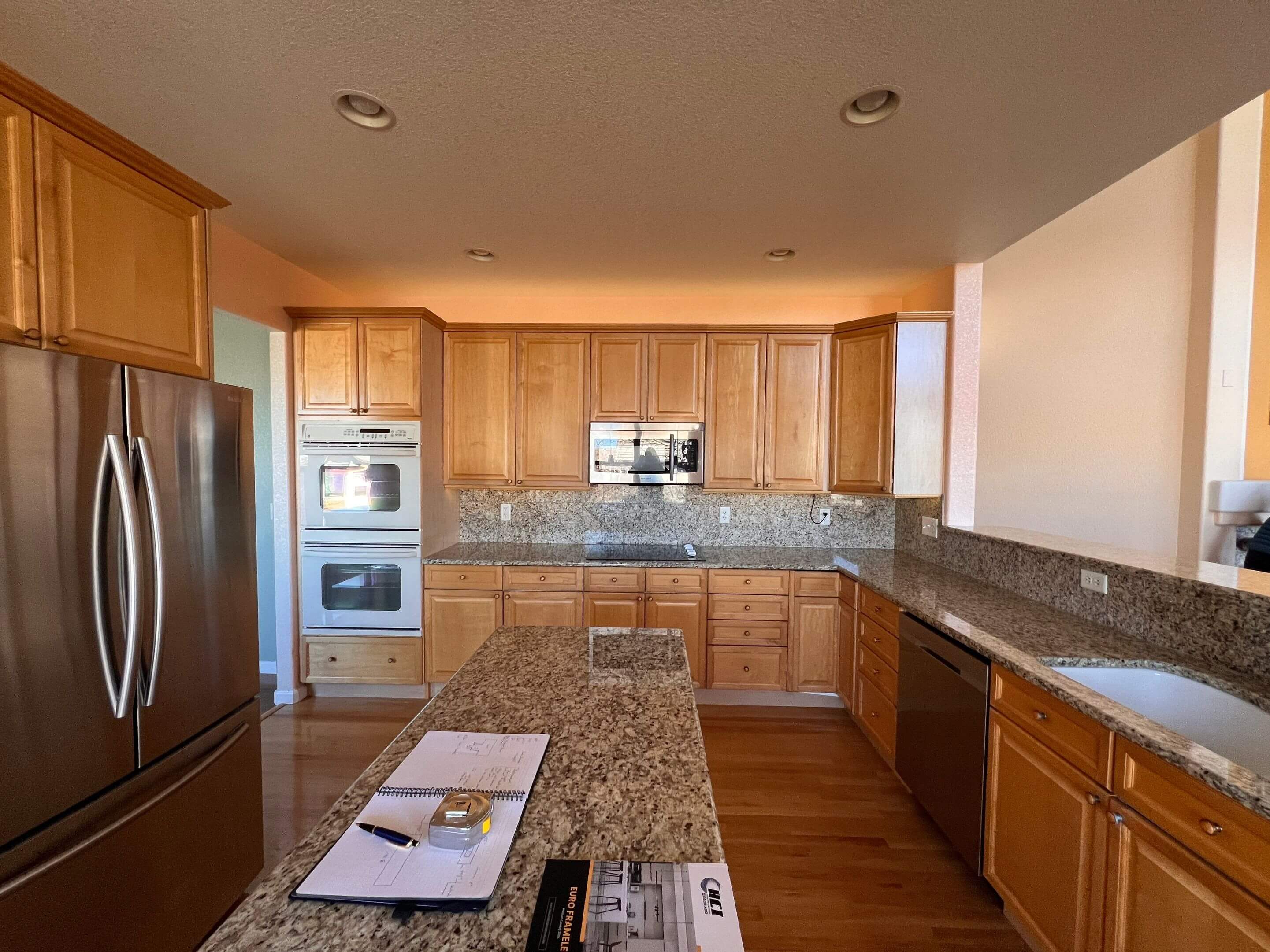 Open-Concept Kitchen — before, kitchen by BDT Construction in Centennial, CO